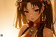 Anime girl with long brown hair wearing a red dress.